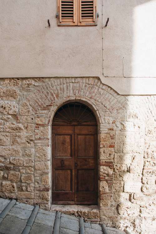 Wood Door In A Stone Wall Photo