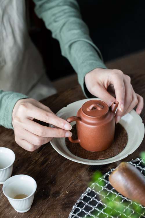 Small Brown Teapot With White Teacups Photo