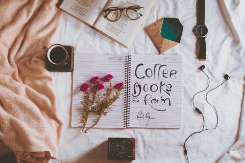 Notebook With Coffee Books And Rain Photo
