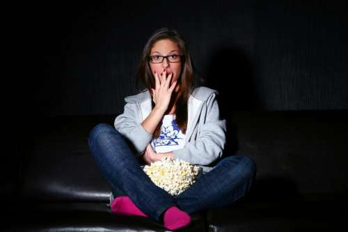 Young woman watching a movie