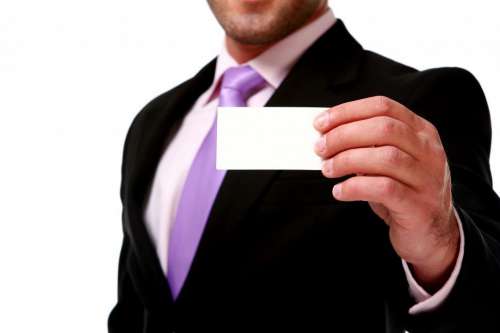 anonymous businessman with blank card