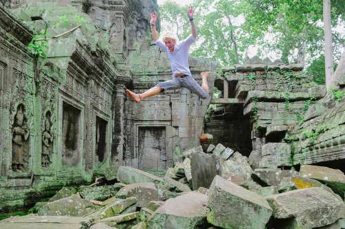 Man Jumping In Old Temple Ruins