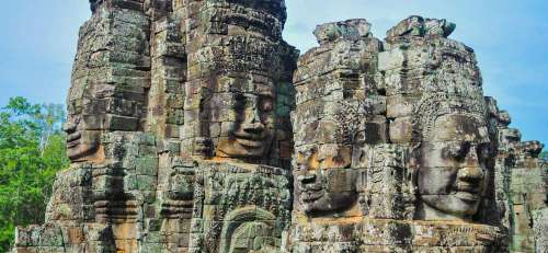 Faces Carved Into Rock In Bayen Temple