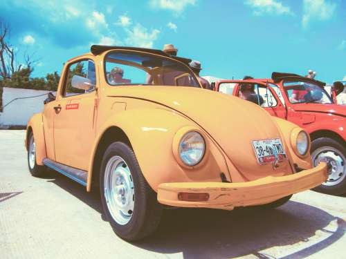 Yellow VW Beatle Car With People