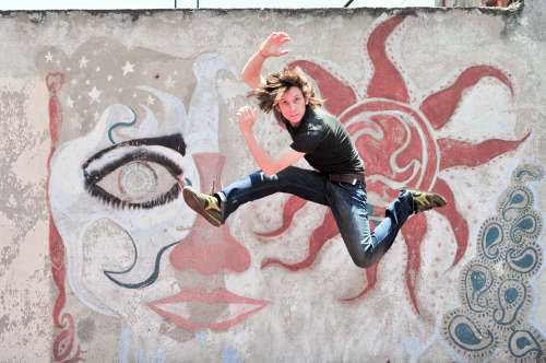 Man Jumping With Rough Wall