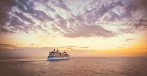 Cruise Ship Sailing Into A Colorful Sunset