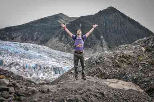 Man Celebrating Freedom In nature With Glacier