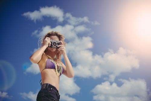 Cute Girl In Bikini Taking Photo With Retro Camera