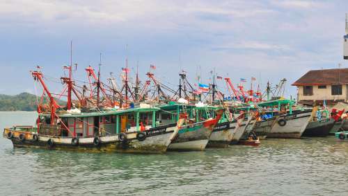 Line Of Colorful Fishing Boats In Asia