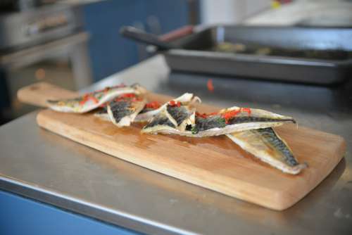 Cooked Sea Bass On Wooden Board