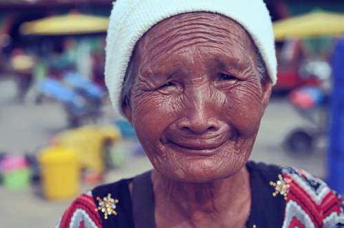 Old Lady With Wrinkles And Smile