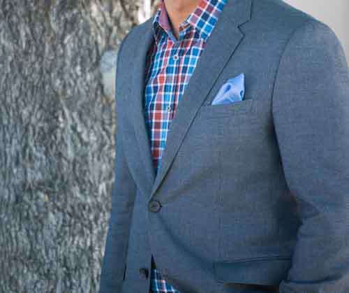 Detail Of Male Fashion Jacket And Colored Plaid Shirt
