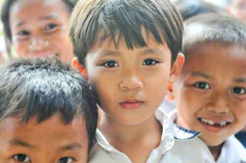 School Boy Looking Intensely At Camera With Little Smile