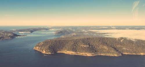 Arial View Of Islands, Water And The Sky With Clouds