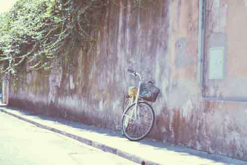 Retro City Bike Leaning Against Old City Wall
