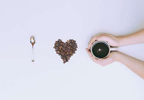 I Love Coffee With Beans And Hands Holding Mug