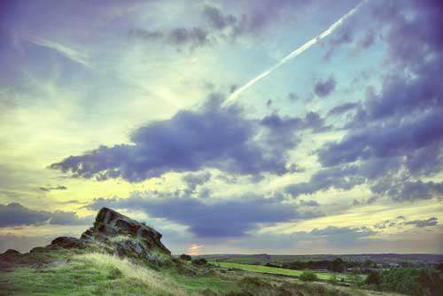 English Countryside Landscape With Large Rock And Fields
