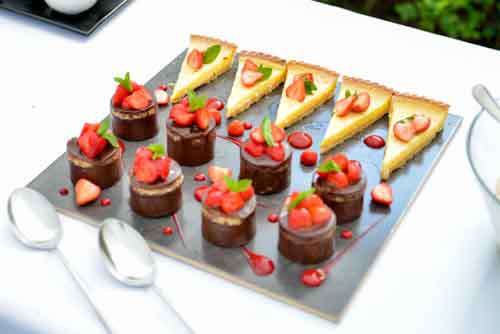 Chocolate, Strawberry And Lemon Deserts On A Table