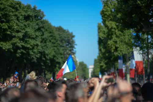 Crowd Of People With Single French Flag
