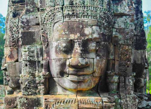 Faces Carved Into Rock In Bayen Temple Cambodia