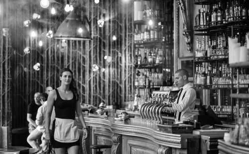 Barman And Waitress In Old Style Cafe In Paris