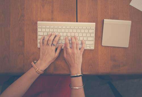 Business Woman Typing On Keyboard With track Pad