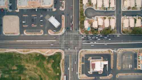 Cars In Traffic At Crossroads From Above