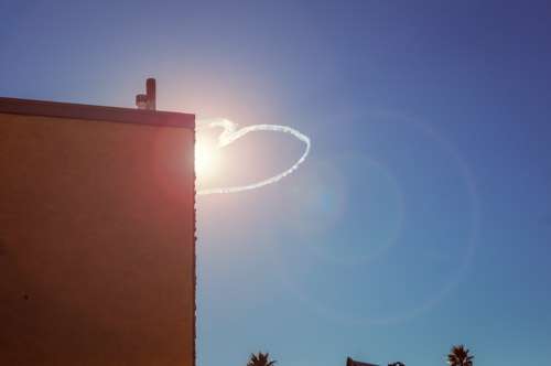 Love Heart Created By Clouds In Blue Sky And Building