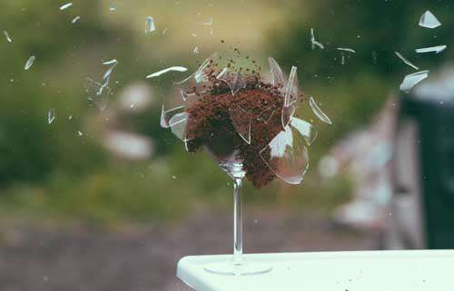 Exploding Wine glass Filled With Dried Coffee