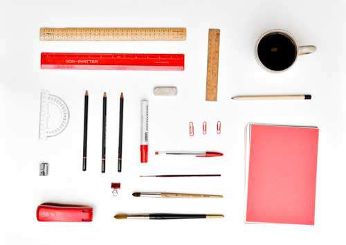 Neatly Organised Design Stationary On White Desk With Coffee