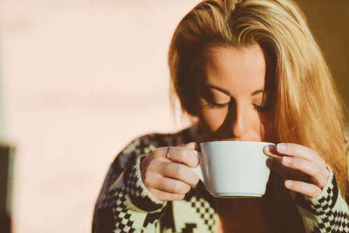 Blond Girl  Peacefully Drinking Coffee At Sunrise