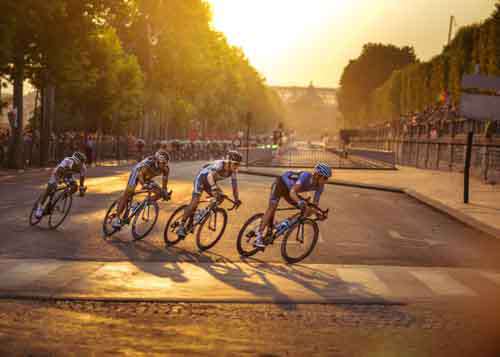 Cyclist Racing Through Paris For Tour De France