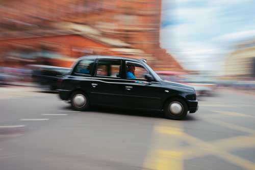 Black Taxi In London And Motion Blur
