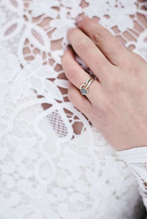 A Close Up Of the Brides Wedding Ring and Band Photo