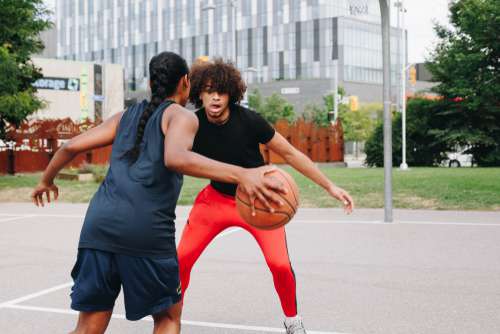 Young Woman Plays Basketball Photo