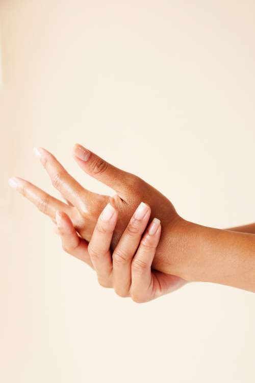 Two Hands Running In Skincare Treatment Photo