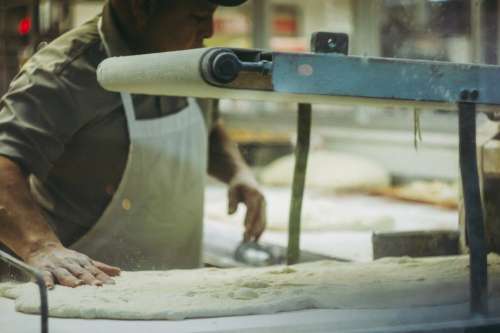 Baker Kneading Out Dough Photo