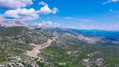 Winding Road Through Wild Landscape Photo