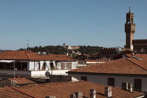 Church Spire Over Terracotta Rooftops Photo