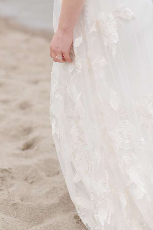 White Wedding Dress On A Beach Photo