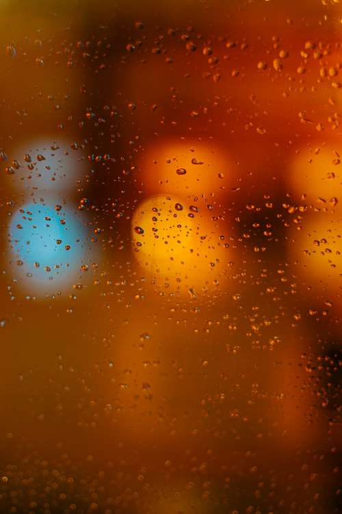 Rain Drops Illuminated On Window Photo