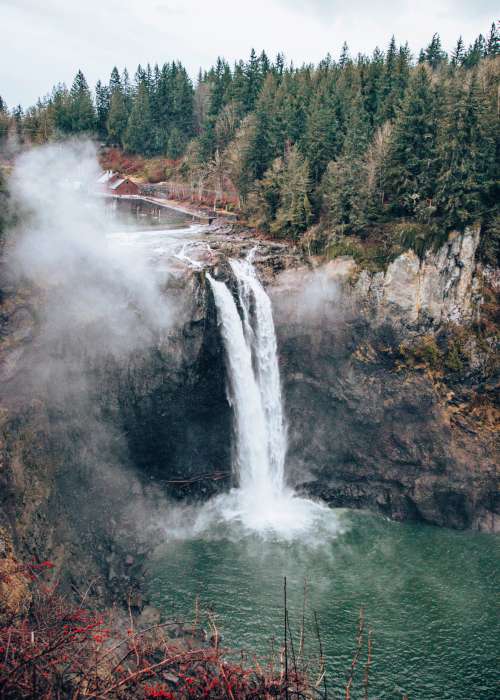 Mist Rises Above Rocky Water Fall Photo