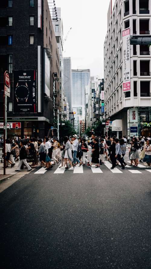 Busy Crossing In Japanese Side Street Photo