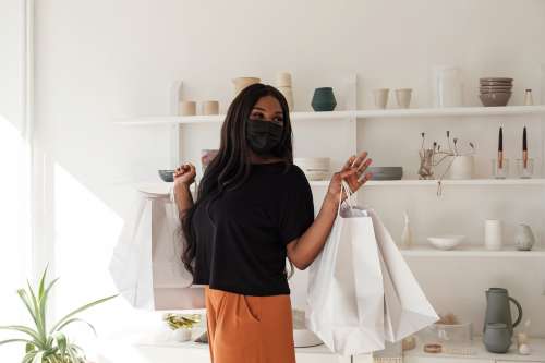 Happy Shopper Waves Goodbye To Store Owner Photo