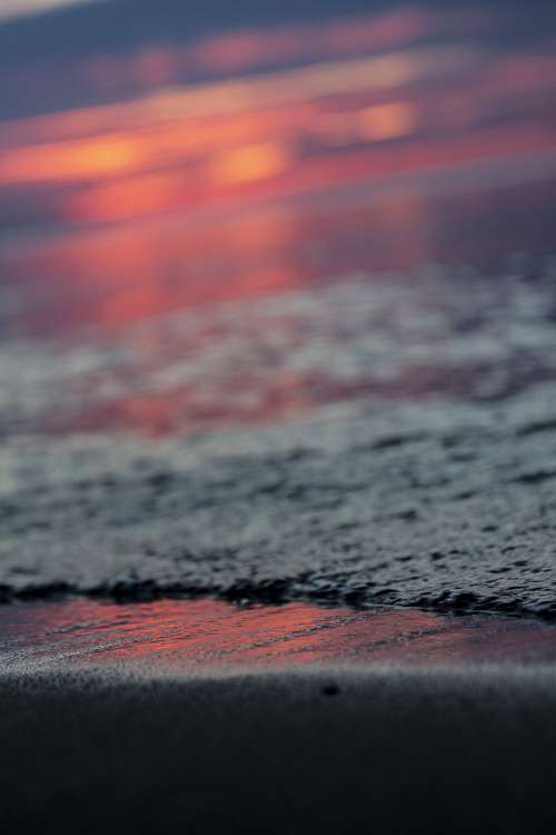 Setting Sun Reflected In Low Tide Photo