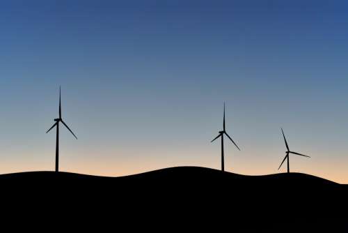 Silhouettes Of Wind Turbines Photo