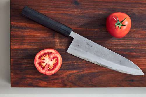 Japanese Kitchen Knife And Tomatos Photo