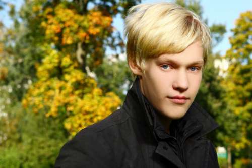 Young and attractive teen posing in park