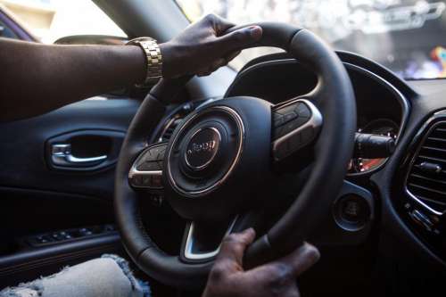 Young Man Driving in an SUV - face not seen