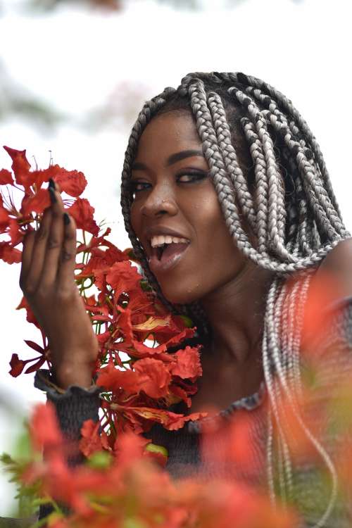 people, beauty, pretty girl, nice, style, pose, posture, elegant, makeup, aesthetic, smile, fashion, facial expression, red flowers, braids, hairstyle, haircut, girl, look, woman, joyful, happiness, gestural
